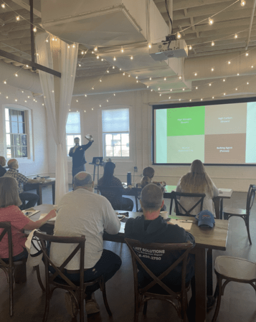 People in a classroom taking a training. 