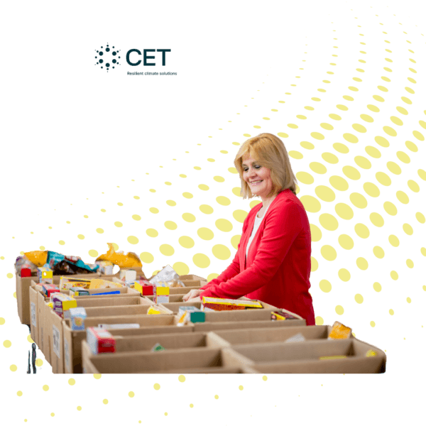 Woman sorting donated food items into cardboard boxes, with a stylized dotted background and CET logo, representing community food donation and distribution efforts.