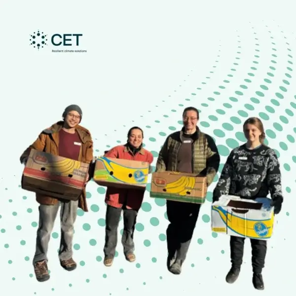 4 people holding a donation box as a community